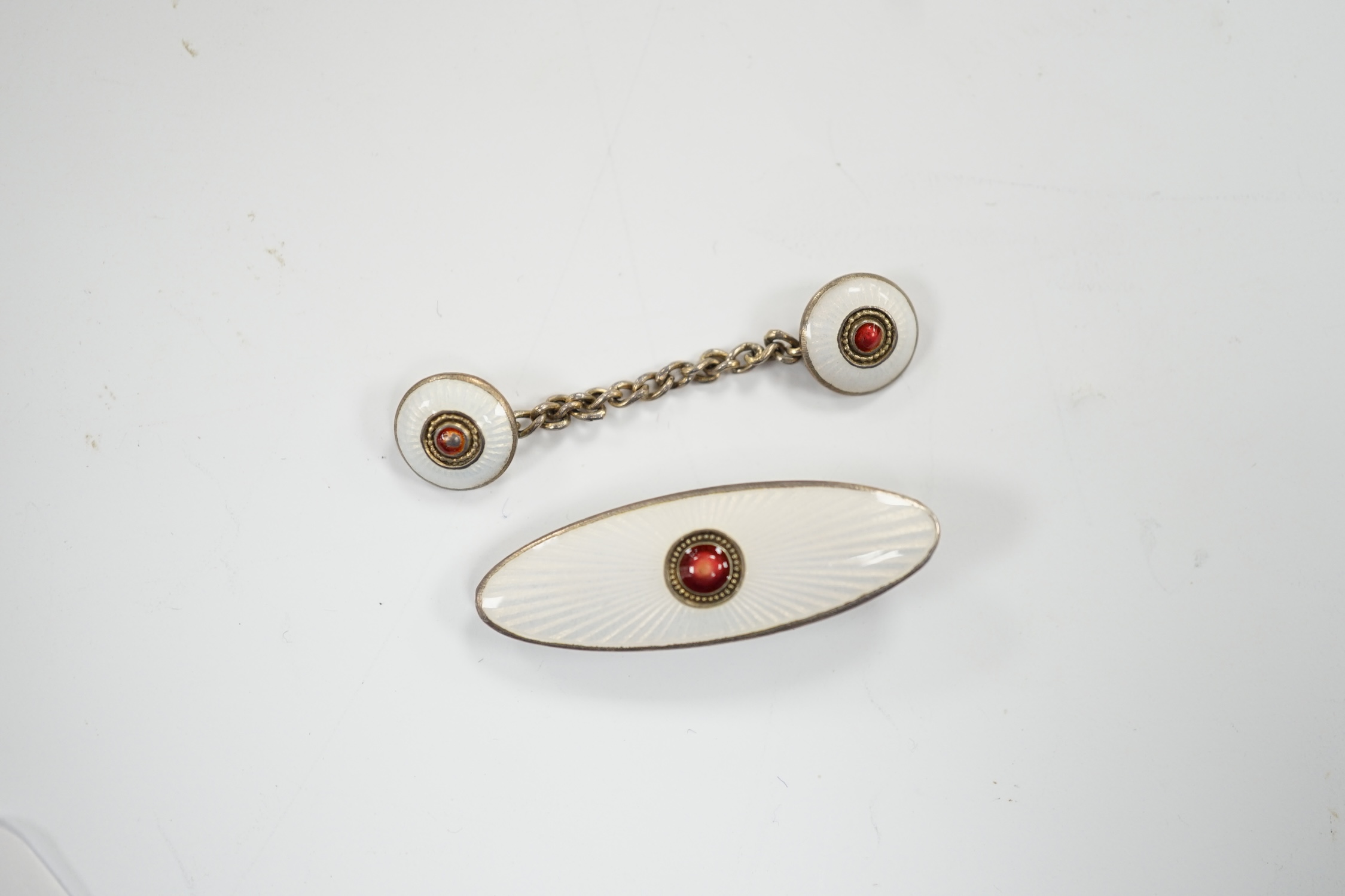 An early 20th century Russian 84 zolotnik and two colour enamel tie clip, 33mm and cloak clasp.